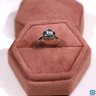 A timeless solitaire engagement ring with a sleek, minimalist design for an understated elegance.
