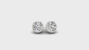 Round bezel diamond earrings, crafted with handmade jewelry expertise for lasting quality.
