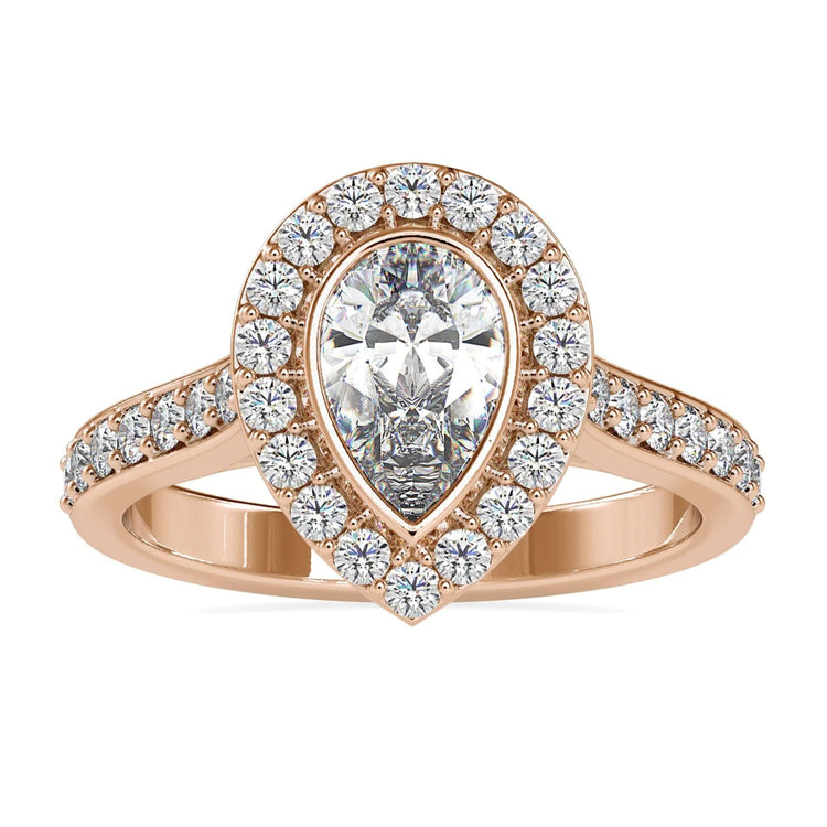 Pear engagement ring with a stunning halo and pave accents.
