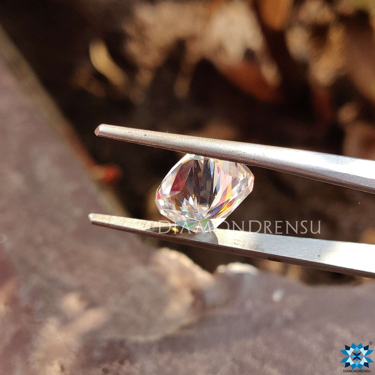 Elongated cushion cut moissanite with soft corners.
