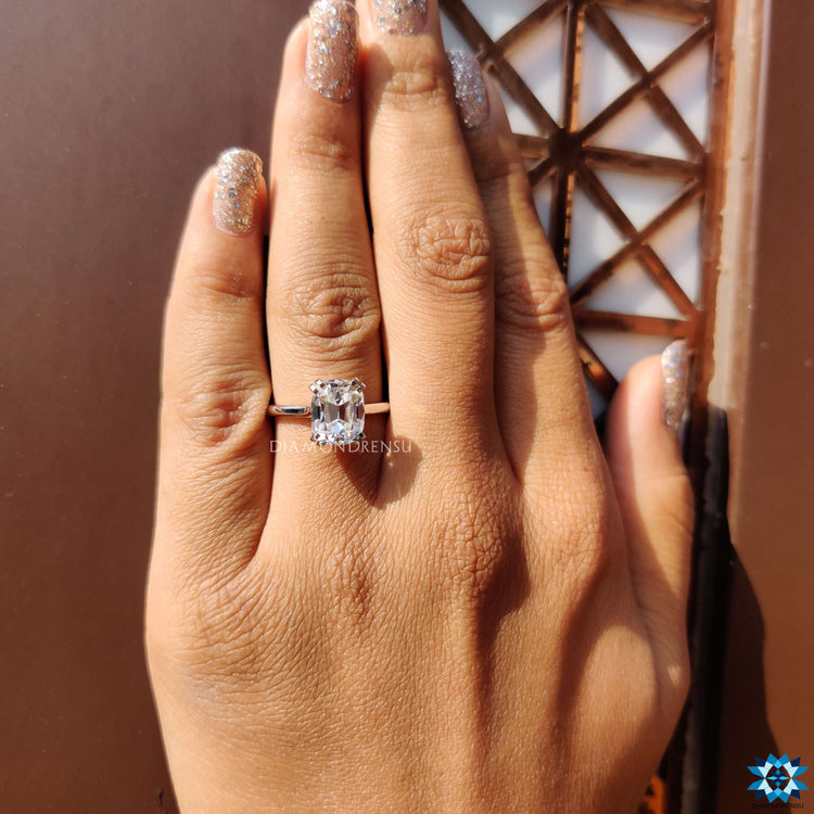Solitaire cushion cut engagement ring with a sleek and sophisticated design.
