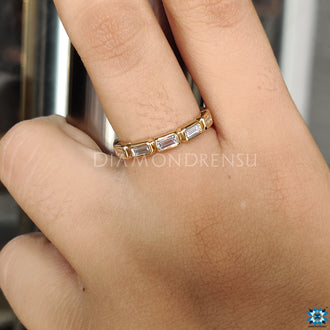 Moissanite wedding band featuring a classic and chic style.