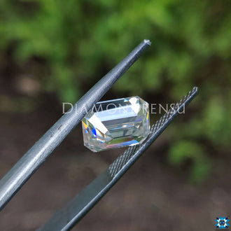 Emerald step cut moissanite paired with loose moissanite stone.
