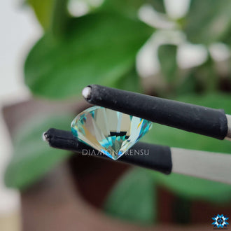 4.81 carat moissanite featured in cyan blue moissanite round cut style.
