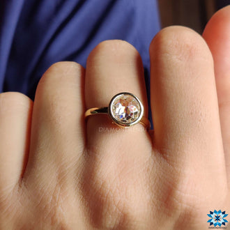 Round bezel set engagement ring for a timeless love story.
