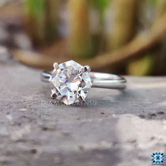 Classic four prong solitaire engagement ring with Hidden Infinity details.
