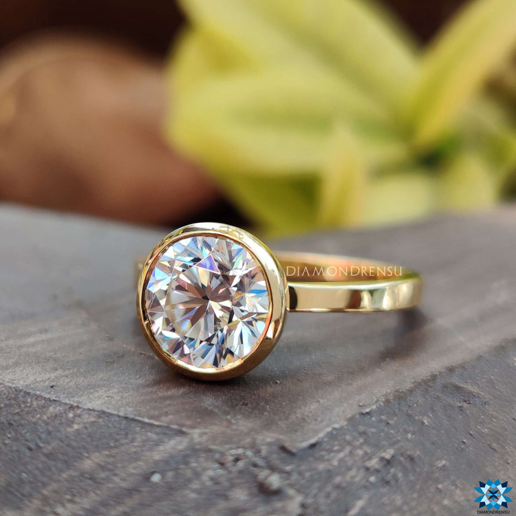 Modern bezel engagement ring round design for a unique touch.

