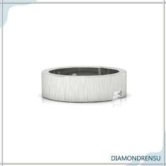 Brushed finish gold wedding band with baguette cut diamonds.
