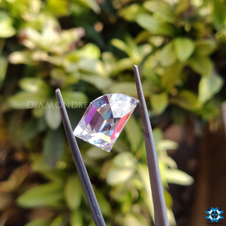 Near colorless moissanite in 6.57 carat elephant tooth cut design ideal for vintage-style pendants.
