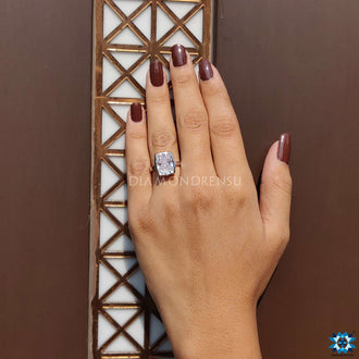 Solitaire bezel ring featuring an elongated cushion stone.