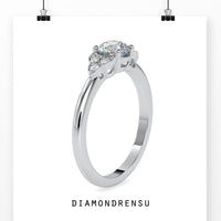 Handmade round diamond ring with a rose gold prong setting
