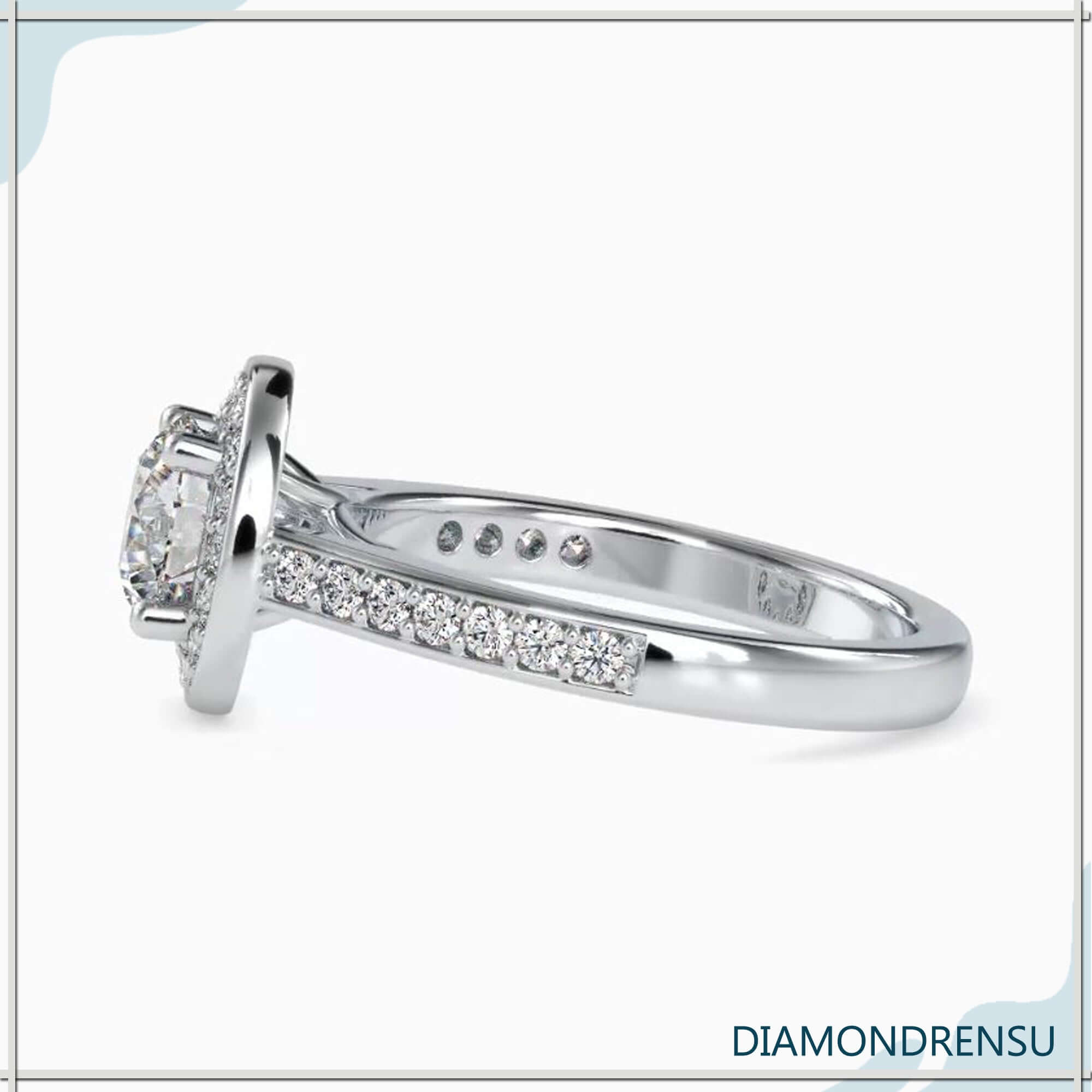 Gorgeous pave engagement ring with a round diamond halo and prong setting.
