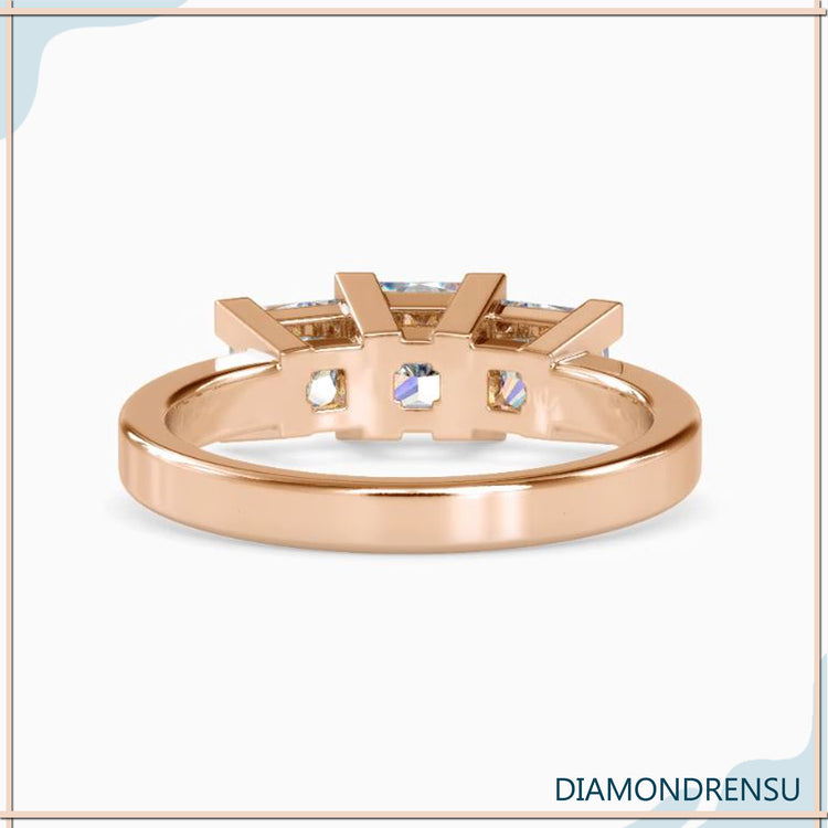 Handmade three stone emerald cut diamond ring in a white gold band