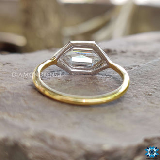 East west moissanite ring with a creative horizontal gemstone design.
