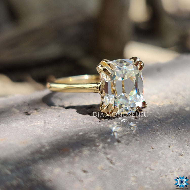 Modern cushion cut moissanite ring with intricate details.
