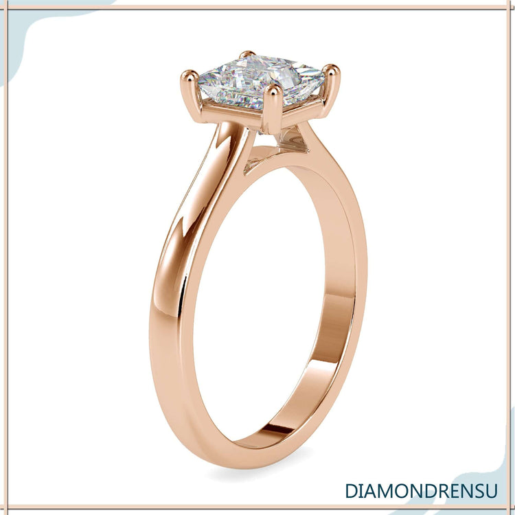 Princess cut solitaire diamond engagement ring featuring handmade jewelry and IGI certified stone.
