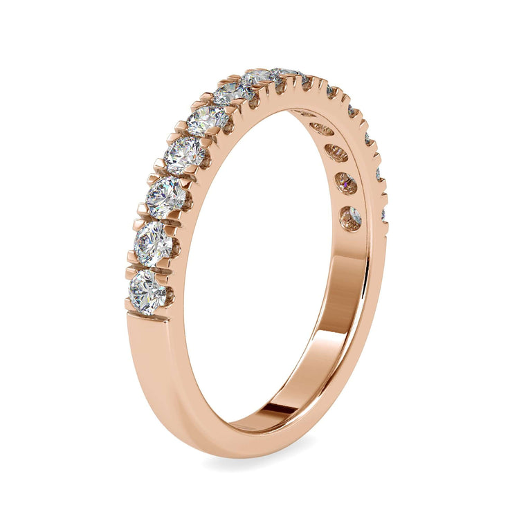 Gold band for women with round diamond settings and a half eternity design.
