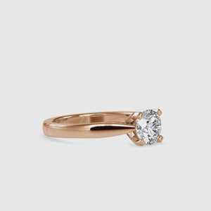 Solitaire engagement ring with round brilliant cut diamond and prong tabs
