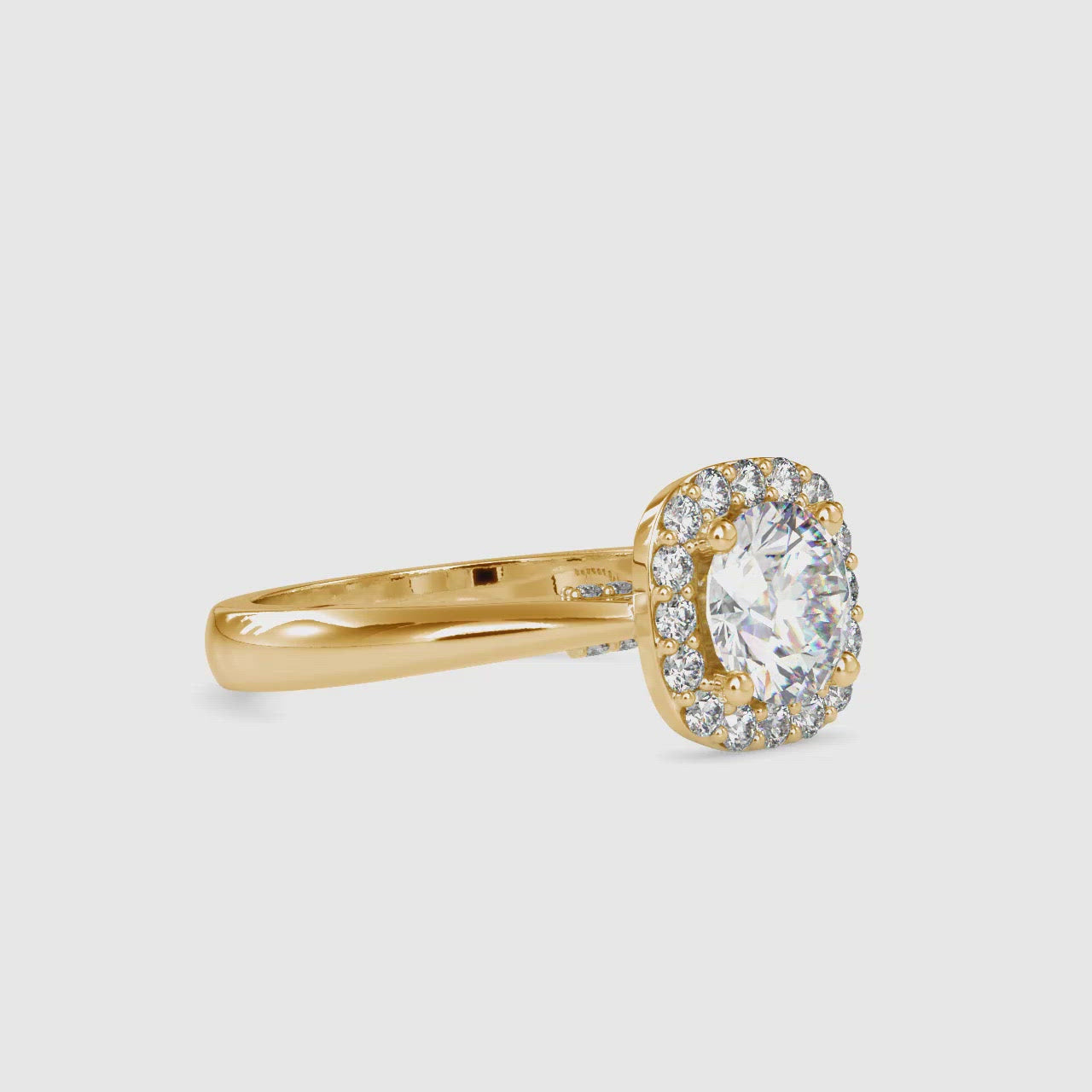 Elegant round brilliant cut diamond ring featuring a cushion halo design.