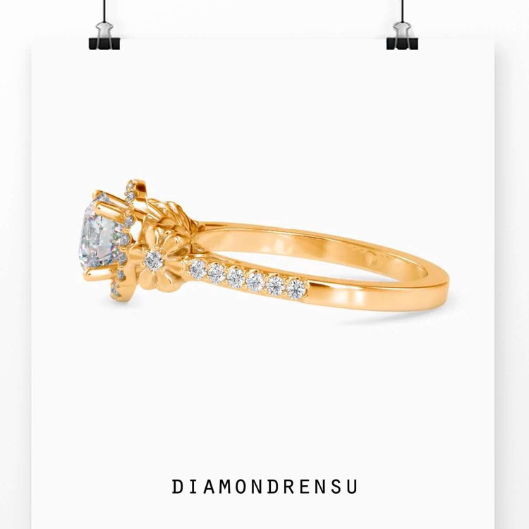 Gold floral ring featuring a diamond and 4 prong setting.
