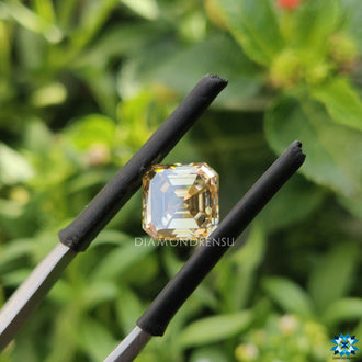 Moissanite loose stone crafted as 1.84 carat moissanite with champagne tone.
