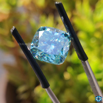 Cyan blue loose stone shown for custom moissanite designs.