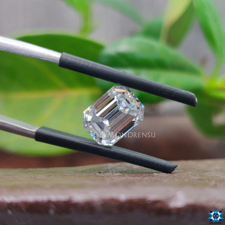 Loose moissanite available as emerald cut 2.04 carat and near colorless gray.
