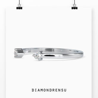 Dainty open cuff band in yellow gold for a modern wedding band look.
