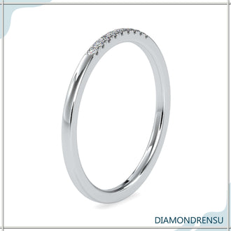 Minimalist wedding band with round diamonds and lab grown diamond band.
