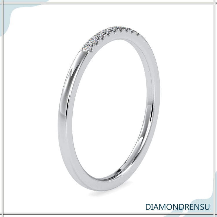 Minimalist wedding band with round diamonds and lab grown diamond band.
