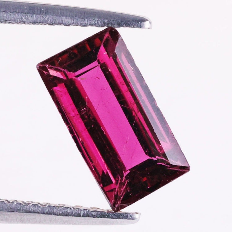 Tourmaline gemstone pink tourmaline emerald cut.
