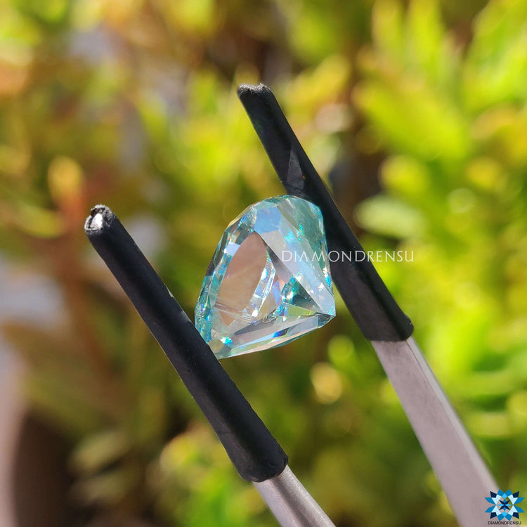 Cushion moissanite cut shown as a loose gem from Diamondresnu.

