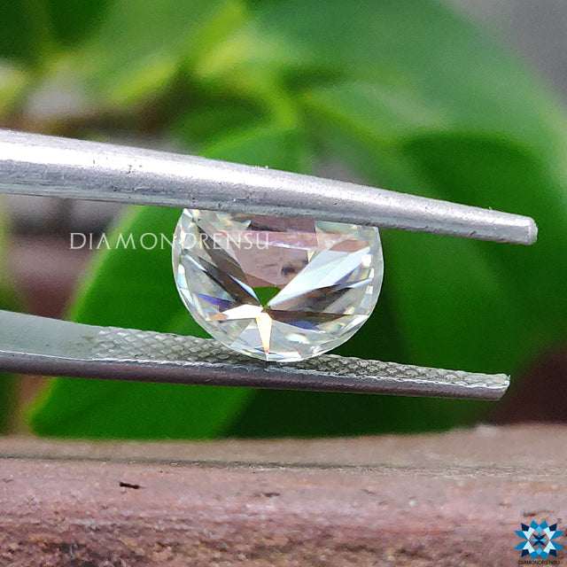 Loose moissanite listed in Half Moon Cut off white green moissanite.
