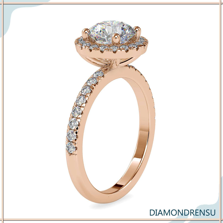 Engagement ring with pave setting featuring a round halo diamond and a 4 prong setting.
