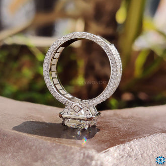 Halo ring design with sparkling baguette cut moissanite side stones
