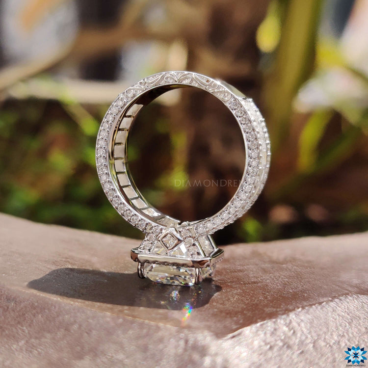 Halo ring design with sparkling baguette cut moissanite side stones
