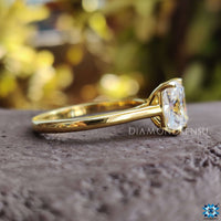 Elongated cushion solitaire crafted with claw prongs.