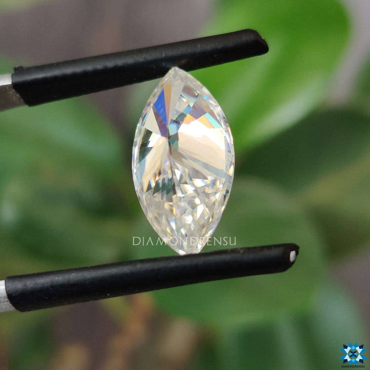 Gleaming moissanite stone paired with marquise cut loose stone.
