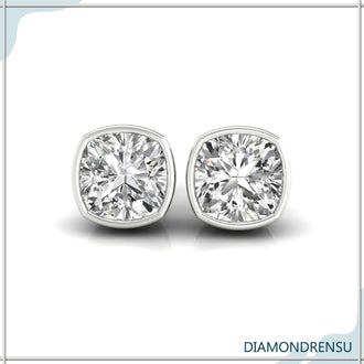 Classic diamond cut earrings featuring cushion cut diamonds, ideal for elegant wedding looks.

