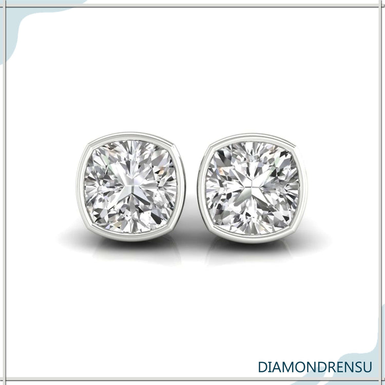 Classic diamond cut earrings featuring cushion cut diamonds, ideal for elegant wedding looks.
