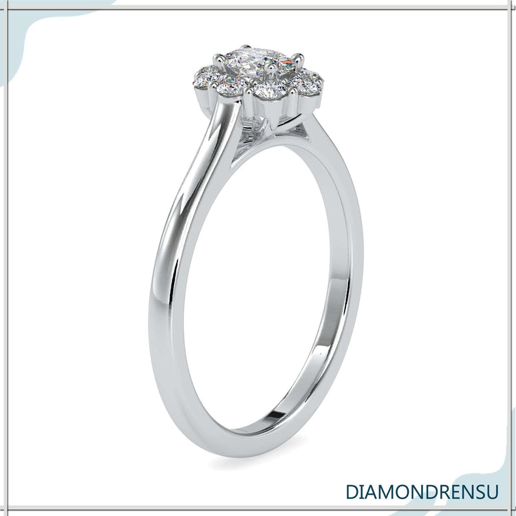 Oval diamond ring in a classic halo cluster design for extra sparkle
