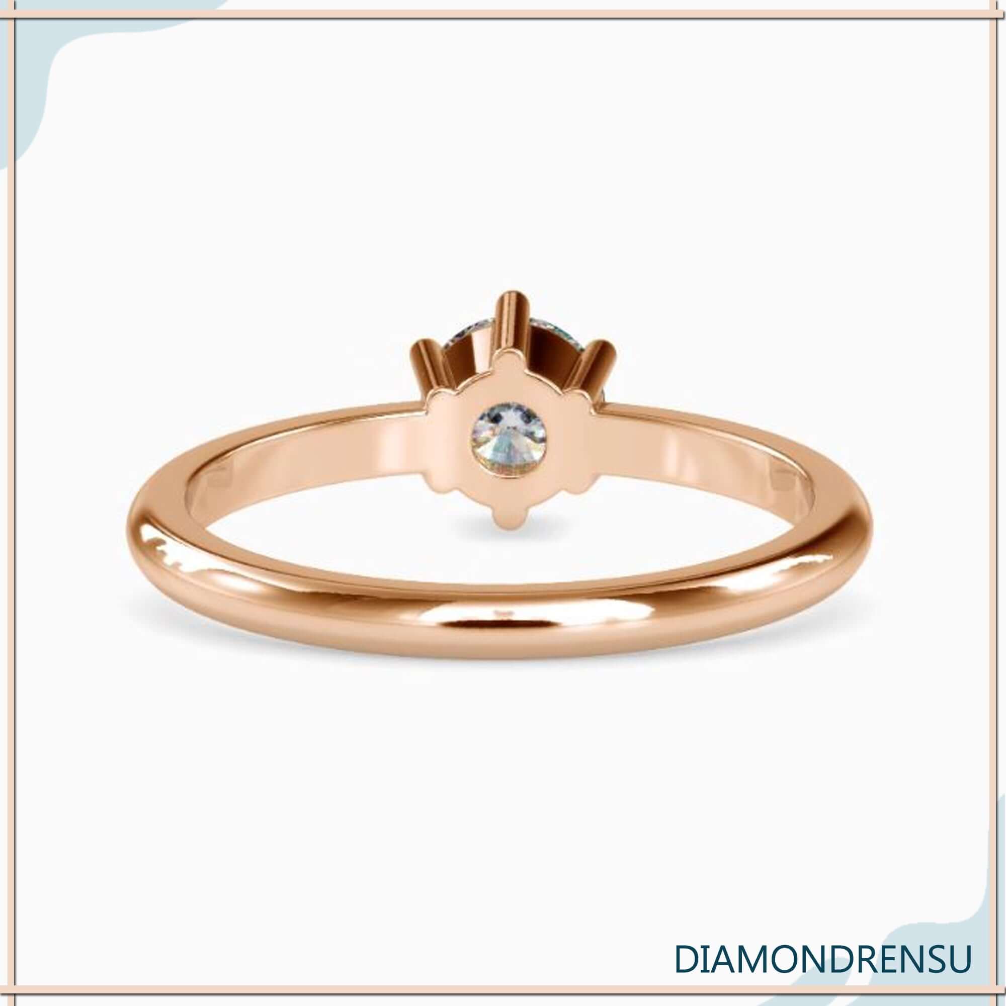 Timeless gold solitaire engagement ring with a six prong setting for extra security.
