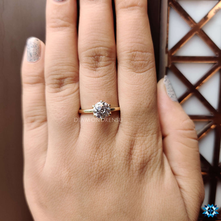 A tulip setting engagement ring with a delicate floral-inspired design, perfect for nature lovers.