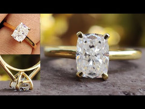 Handmade elongated cushion cut solitaire for a classic look.