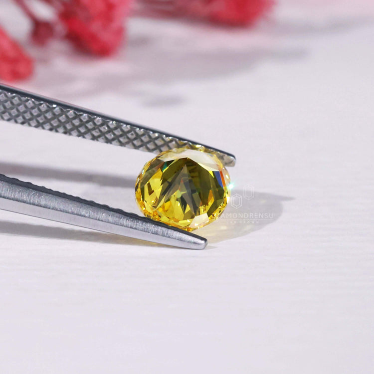 Certified loose yellow diamond with oval cut.
