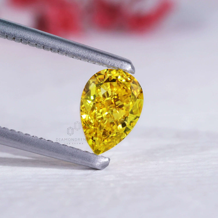 A 1.10 carat yellow pear diamond in lab grown clarity and vibrant color.
