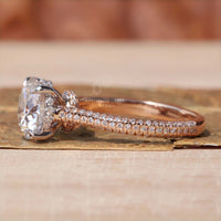 Round diamond engagement ring in white and rose gold.
