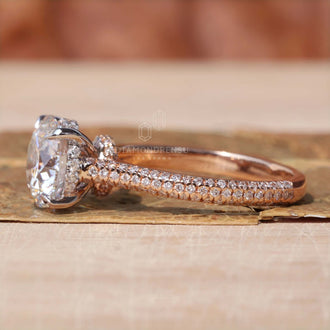 Round diamond engagement ring in white and rose gold.
