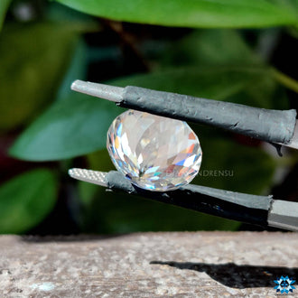 Round Portuguese moissanite cut shown as a single loose stone.
