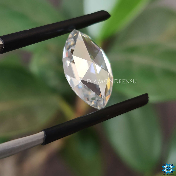 Light gray moissanite glowing beside moissanite loose stone.
